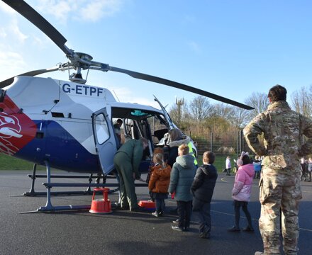 Children waiting to get into the helicopter 2